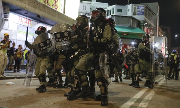 Riot police clash with protesters on the street of Yuen Long, Hong Kong on 21 October. 