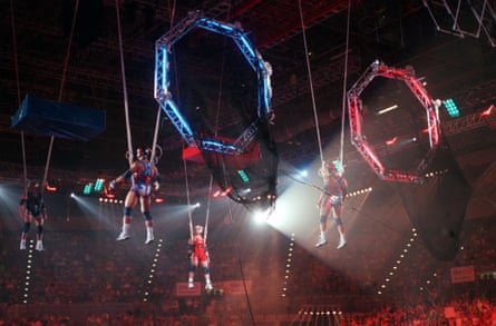 Contestants taking part in the Catapult game in the original Gladiators TV series, in the 1990s, hanging in the air above an arena full of people