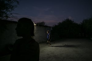 Elder Bautista and his mother in front of their home in El Mayor, Baja Calfornia Norte, Mexico.