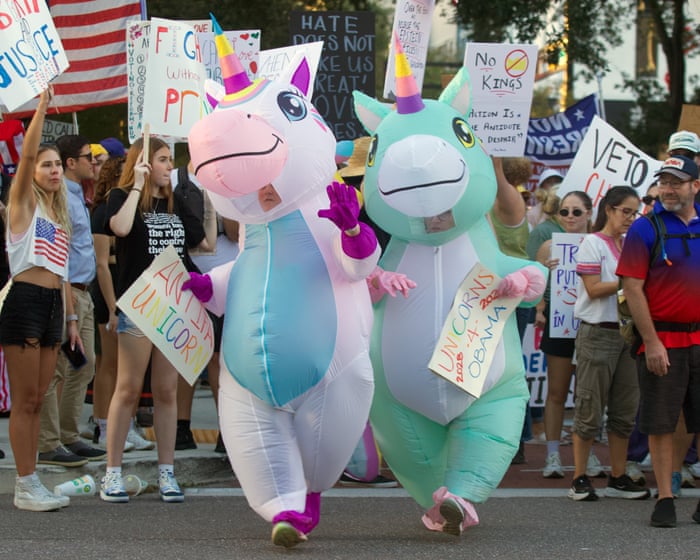 Silly inflatable costumes are taking over anti-Trump protests. What are they actually saying?