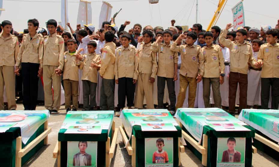 Yemeni children at a mass funeral after an attack on a school bus in 2018.