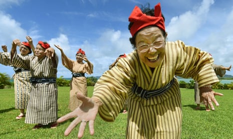 An elderly women band of singers and dancers from Kohama Island in Okinawa wearing traditional local costumes perform at a herb garden on Kohama Island, Okinawa Prefecture. The band has an average age of 84.