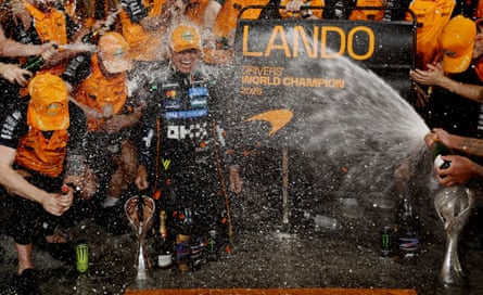Lando Norris celebrates with his team after becoming world champion