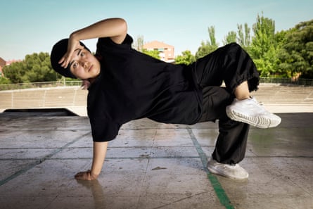young woman breakdancing