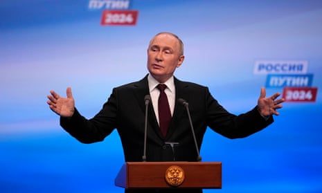 Vladimir Putin speaks on a visit to his campaign headquarters after the presidential election in Moscow.