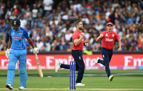 England's Chris Woakes celebrates the wicket of India's KL Rahul.