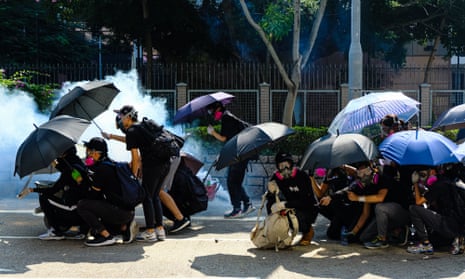 Riot police fire tear gas at the protesters during a protest in Jordan district of Hong Kong 