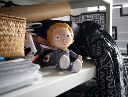 Sitting on a shelf, a a prototype for a Mr Doodle doll, based on the doodle artist Sam Cox