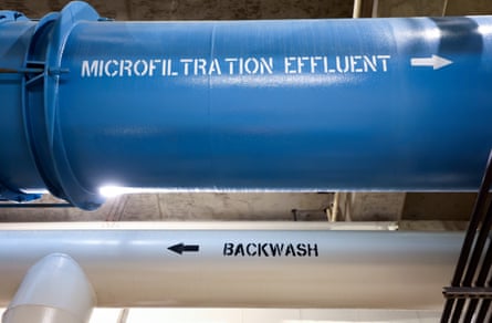 A blue pipe with ‘microfiltration effluent’ on it and a silver pipe with ‘effluent’ on it