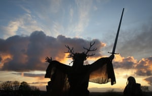 The winter king holds a sword as he takes part in the sunset ceremony.
