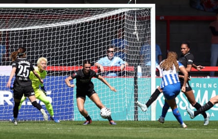 Madison Haley fires home Brighton’s first goal against Manchester City.
