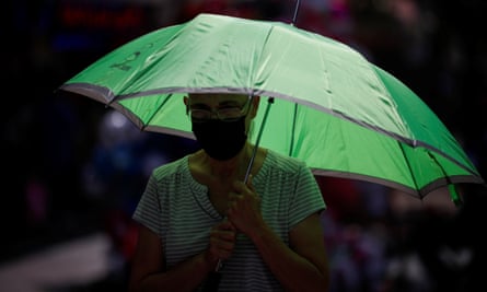 A woman takes shelter from the sun in Monterrey, Mexico.