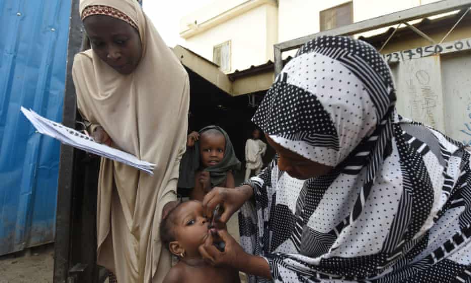 A health worker immunises a child during a vaccination campaign in north-west Nigeria