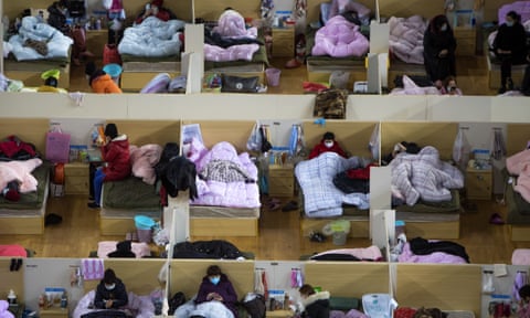 Coronavirus patients in a temporary hospital converted from a sports centre in Wuhan in February.
