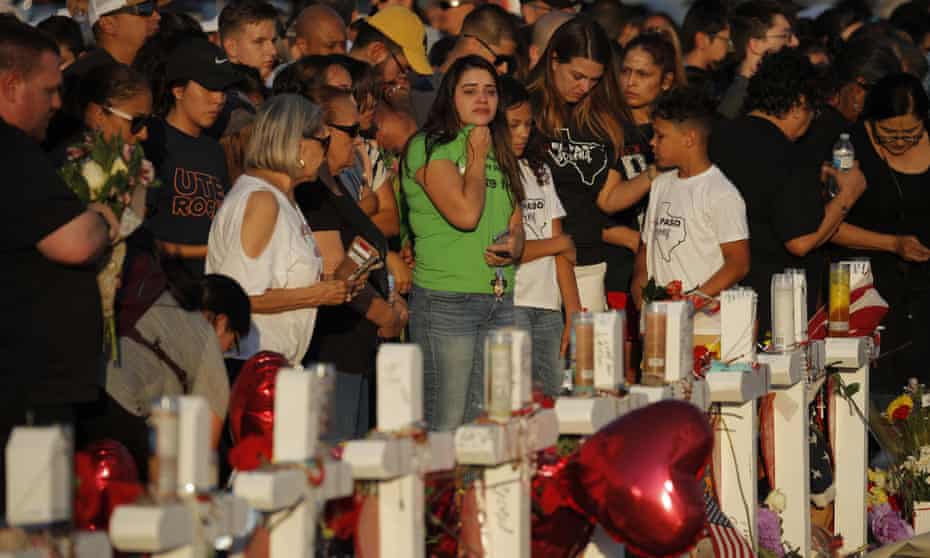 People visit a makeshift memorial in El Paso on 6 August.