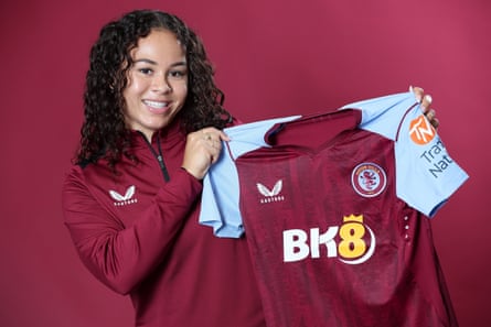 Ebony Salmon shows off her new Aston Villa shirt