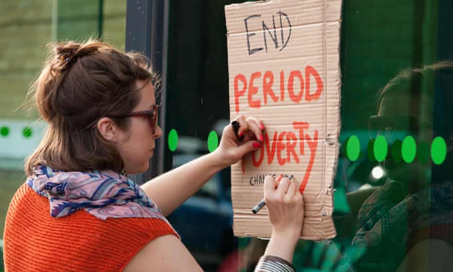 A campaigner outside a supermarket in East London calls for a reduction in prices to offset the ‘tampon tax’. 