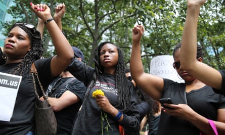 Protesters hold their fists in the air during a Black Lives Matter demonstration in New York on 10 July 2016.