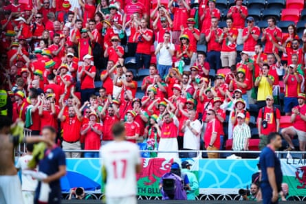 Welsh fans applaud Iranian players at full-time.