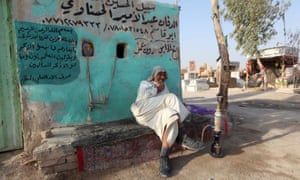 An undertaker smokes his shisha.
