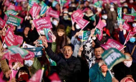 Supporters of Lai Ching-te wave flags