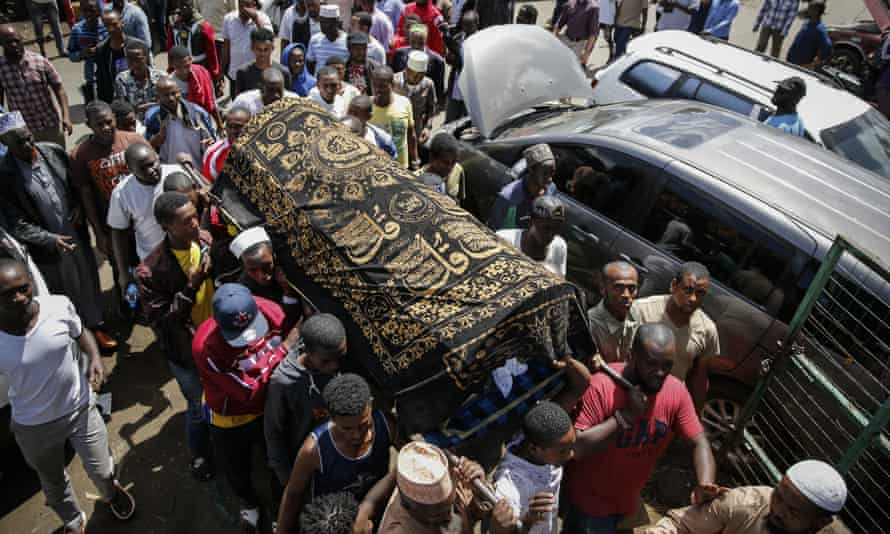 Family members carry the coffin of 13-year-old Yasin Hussein Moyo