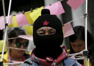 Mexico City, Mexico A member of the indigenous Zapatista National Liberation Army (EZLN) takes part in a demonstration to mark International Women’s Day, outside the Palacio de Bellas Artes