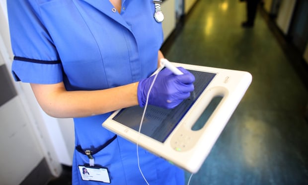 A nurse uses a wireless electronic tablet to order medicines from the pharmacy at The Queen Elizabeth Hospital on March 16, 2010 in Birmingham, England.