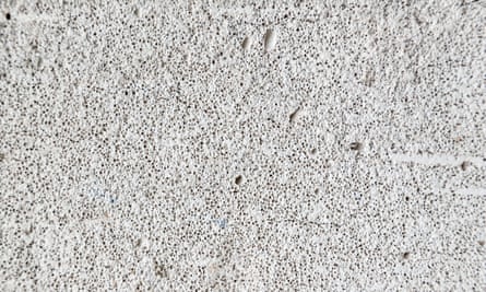 The surface of a piece of reinforced autoclaved aerated concrete, showing its foamlike texture