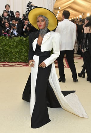 Artist of the moment Janelle Monae stuck to her signature black and white but stepped it up a notch with her Marc Jacobs gown, complete with gold halo hat and silver head scarf.