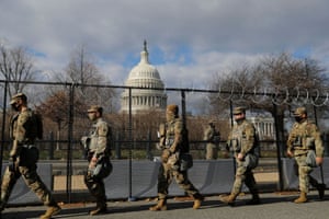 National Guard members patrol near the Capitol building in Washington DC. 