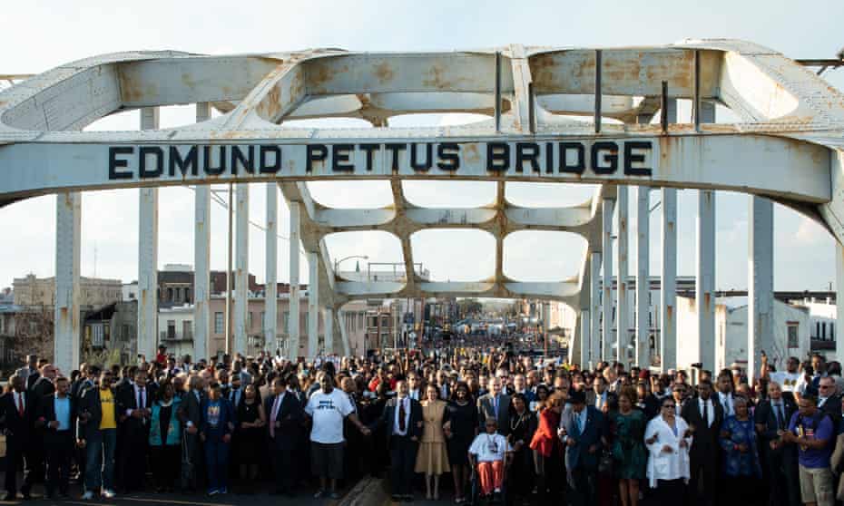 Vice-president Kamala Harris and civil rights leaders ceremonially cross the Edmund Pettus Bridge in Selma, Alabama, on 6 March, to commemorate the 57th anniversary of Bloody Sunday.