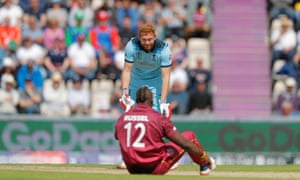 England’s Jonny Bairstow looks at West Indies Andre Russell after he took a ball on the helmet.