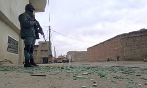 Security forces guard the area around the Ministry of Defence during fighting with Taliban militants.