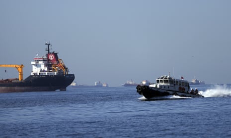 A boat with Russian, Ukrainian, Turkish and U.N. officials heads to inspect cargo ships coming from Ukraine loaded with grain, in the Marmara Sea in Istanbul, Turkey.