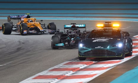 Lewis Hamilton follows the safety car at the Yas Marina Circuit before the controversial final lap