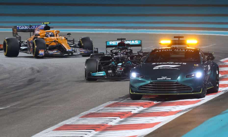 Lewis Hamilton follows the safety car at the Yas Marina Circuit before the controversial final lap