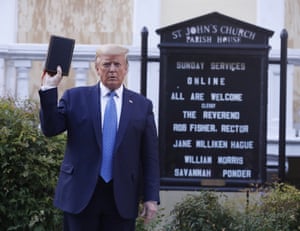 Trump holds his Bible in front of St John’s church.