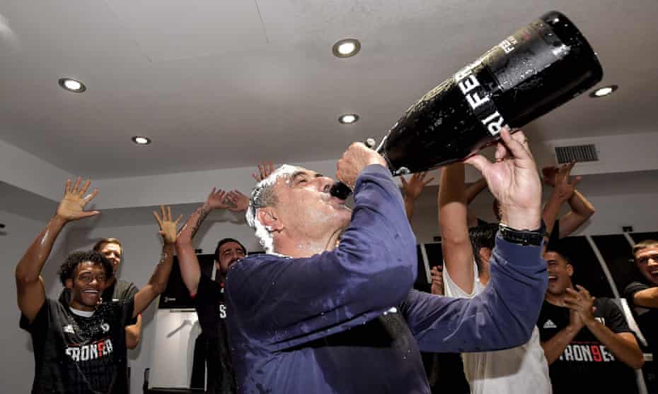Maurizio Sarri, covered in shaving foam, celebrates in the dressing room after winning his first Serie A title as Juventus manager.