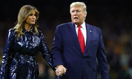 Donald and Melania Trump exit the pitch before a college football play-off game between Clemson and Louisiana State, January 2020.