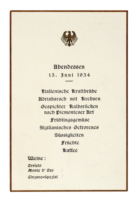 A menu with the Third Reich symbol at the top, written in Germany detailing several courses and the wine choice