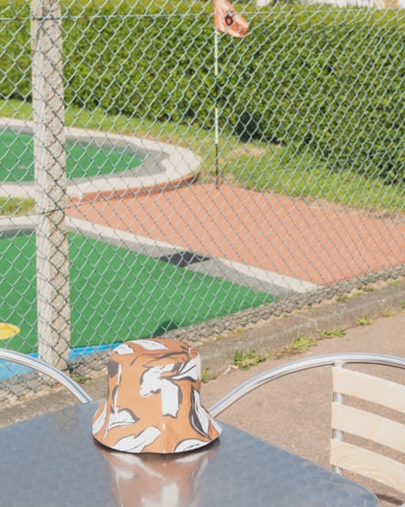Bucket hat on table by minigolf course