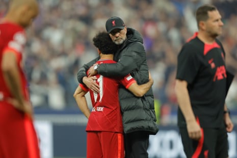 Liverpool manager Jurgen Klopp consoles Mohamed Salah after their defeat.