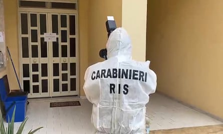 A video grab released by the Carabinieri shows an officer taking images of Denaro’s apartment building