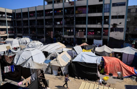 Palestinians displaced by the Israeli military offensive shelter in tents in a UNRWA school, in Khan Younis, in the southern Gaza Strip, June 4, 2025.