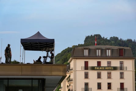 US Secret Service counter-snipers stand guard on a roof in Bürgenstock, Switzerland, where the talks are taking place.