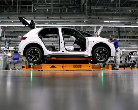 Workers on a Volkswagen assembly line