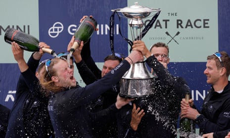 The Oxford crew celebrate with the trophy after ending a five-year wait to win the men’s Boat Race.
