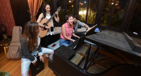 Communal HousingResidents and friends sing and play instruments in the living room of Euclid Manor, a 6,200 sqft co-living house with 11 roommates in Oakland, California on March 13, 2016. The commune’s residents maintain a theme of social impact, creativity and positive change.