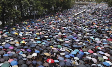 Protesters faced heavy rain during Sunday’s rally.